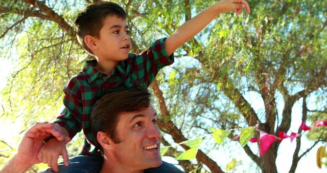 Father and Son Enjoying Outdoor Festivals, Quality Time - Download Free Stock Images Pikwizard.com