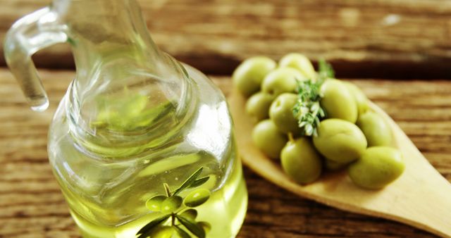 Olive Oil and Fresh Olives on Wooden Spoon - Download Free Stock Images Pikwizard.com