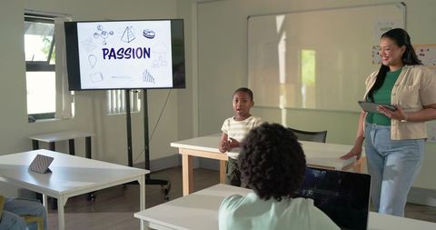African American teacher guiding kid presenting Passion slide during interactive class activity