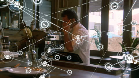Businessman Connecting Through Digital Network in Modern Café