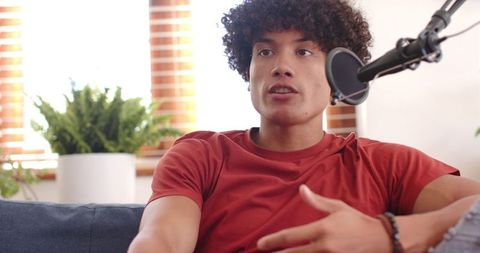 Young Podcaster Speaking in Home Studio