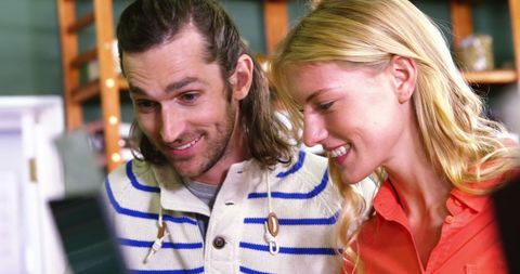 Happy shopkeepers at organic food store