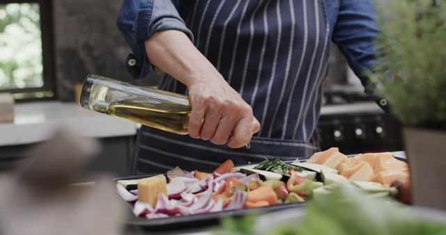 Person Cooking Fresh Vegetables in Kitchen Wearing Apron - Download Free Stock Images Pikwizard.com