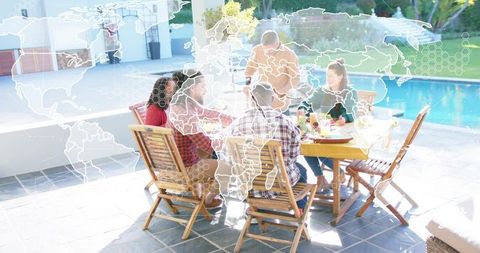 Group Sharing Casual Poolside Lunch with World Map Overlay in Sunlit Backyard