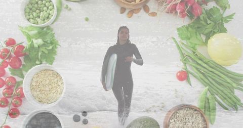 Female surfer walking with bodyboard on shoreline carrying board with healthy food collage