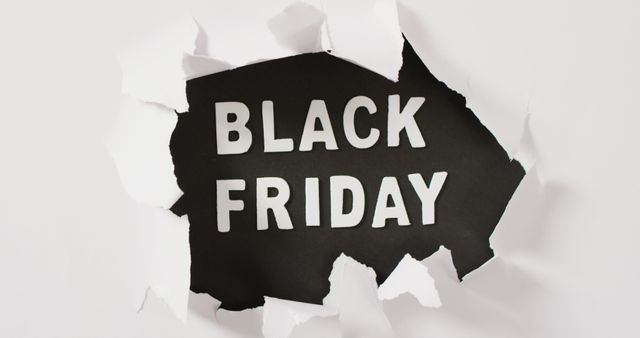 Ripped white paper over black friday text in white on black background. Black friday, shopping, sale and retail concept digitally generated image.