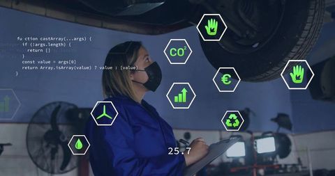 Automotive technician analyzing vehicle damage report using futuristic interface