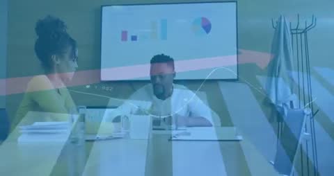 Team Discussing Business Strategy with Analytics on Display