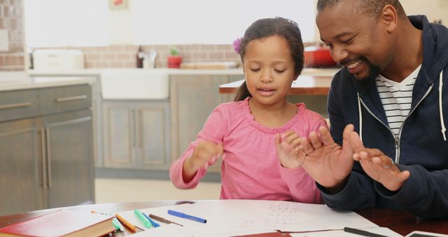 Father Helping Daughter with Schoolwork at Home - Download Free Stock Images Pikwizard.com