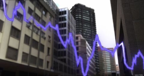 Financial Data Projection Over Blurred Cityscape