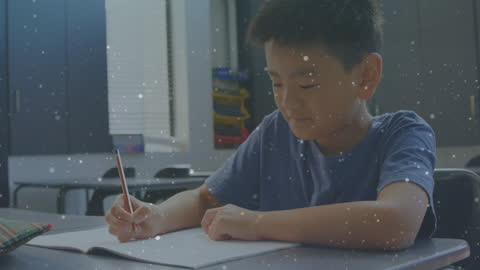 Smiling Schoolboy Studying at Desk with Digital Overlay