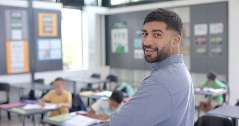 Confident Young Teacher Overseeing Classroom Learning