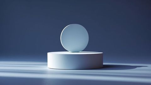 Modern minimalist sculpture with white sphere on cylinder in blue studio