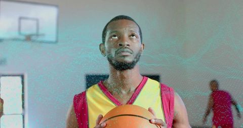 Determined Basketball Player Intently Focused Holding Ball Indoors