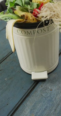 Vertical Compost Bin Overflowing with Organic Waste