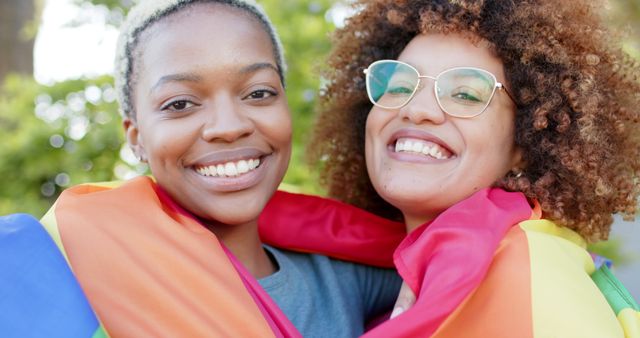 Smiling Friends Embracing with LGBT Pride Flag Outdoors - Download Free Stock Images Pikwizard.com