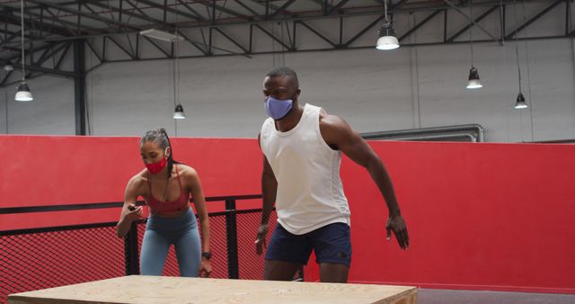 Fit Individuals Training with Face Masks in Indoor Gym - Download Free Stock Images Pikwizard.com