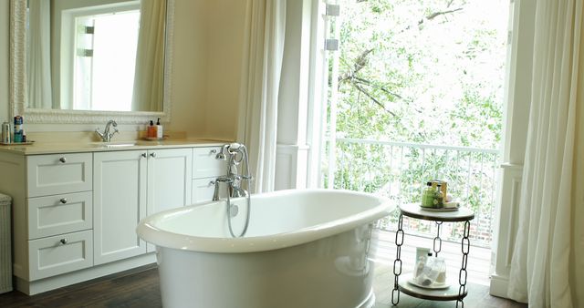 Modern White Bathroom with Freestanding Bathtub and Balcony View - Download Free Stock Photos Pikwizard.com