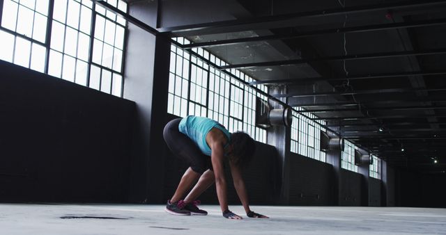 Woman Practicing Fitness Exercise in Industrial Gym Environment - Download Free Stock Images Pikwizard.com