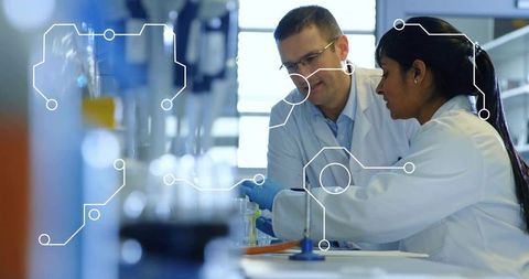 Collaborating scientists conducting laboratory experiments with pipettes, digital tech overlay