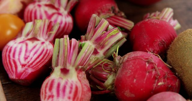 Sliced Candy Cane Beets and Fresh Produce on Rustic Wooden Surface - Download Free Stock Images Pikwizard.com