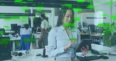 Confident Professional Checking Tablet in High-Tech Office