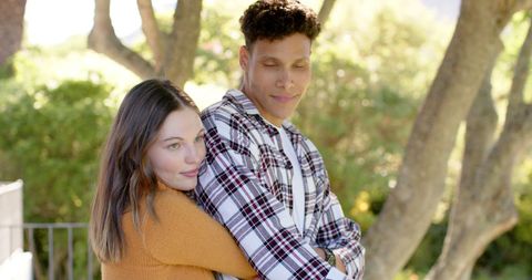 Joyful Interracial Couple Embracing Outdoors - Download Free Stock Images Pikwizard.com