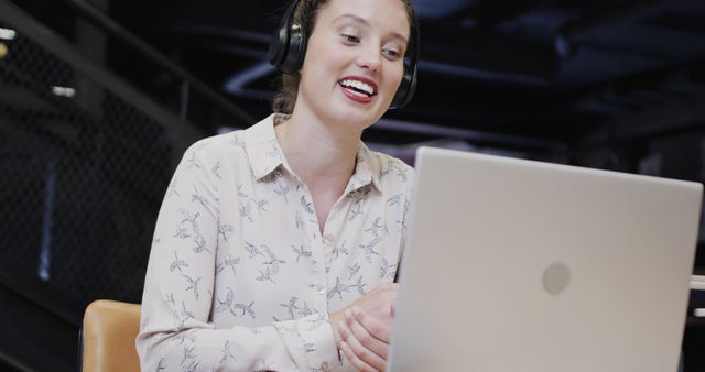 Person Communicating Online with Headphones and Laptop in Office - Download Free Stock Images Pikwizard.com