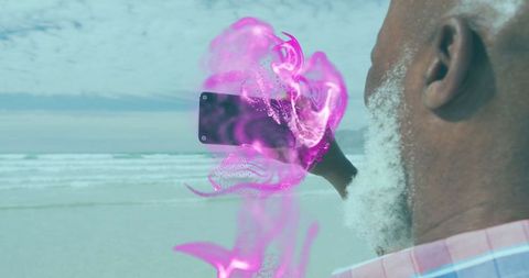 Man Experiencing Augmented Reality Effects on Beach