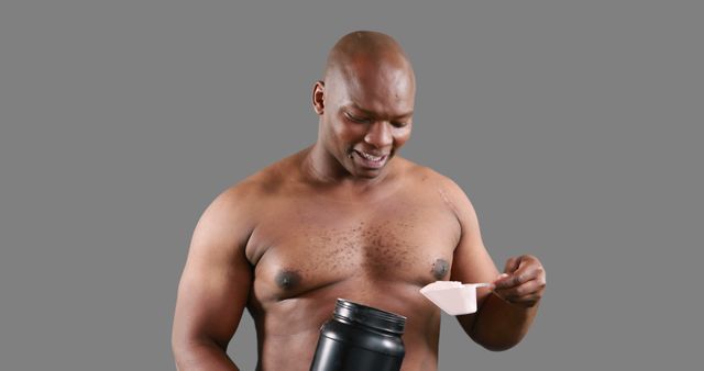 Smiling Athlete Holding Supplement Container and Measuring Scoop - Download Free Stock Images Pikwizard.com