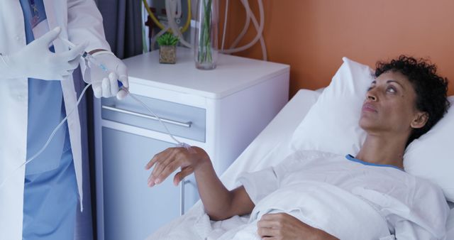 Doctor Preparing IV for Patient in Hospital Room - Download Free Stock Images Pikwizard.com