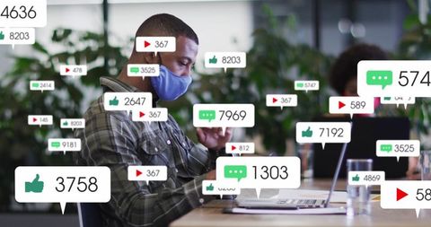 Professional Wearing Mask Engaging Online in Modern Workspace