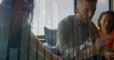 Business Team Analyzing Financial Data with Digital Interface Elements