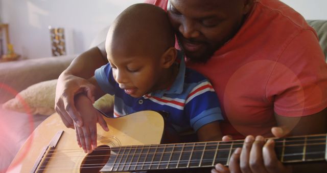 Father and Son Bonding Over Guitar Playing at Home - Download Free Stock Images Pikwizard.com