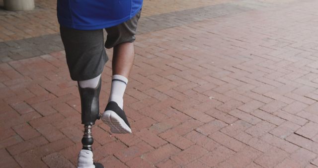 Individual Walking with Prosthetic Leg Outdoors - Download Free Stock Images Pikwizard.com