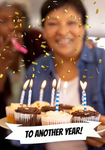 woman celebrating birthday holding candles on cupcakes - Download Free Stock Templates Pikwizard.com