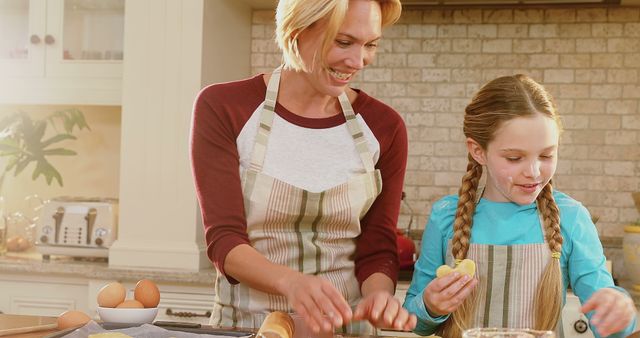 Mother and Daughter Baking Cookies Together in Cozy Kitchen - Download Free Stock Images Pikwizard.com
