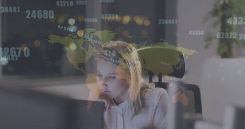 Concentrated businesswoman analyzing global financial data at night