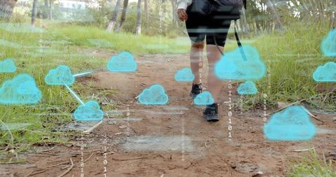 Hiker walking on woodland trail with cloud computing overlay and streaming binary code