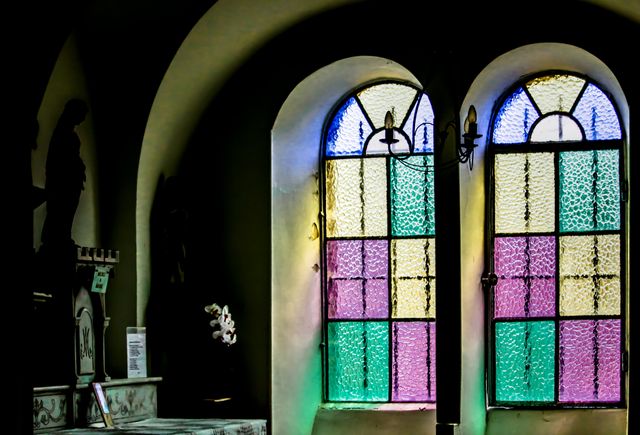 Sunlight Through Yellow Green and Purple Stained Glass Window - Download Free Stock Photos Pikwizard.com