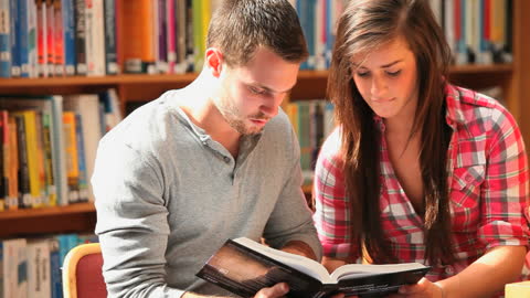 Students Collaborating on Study Project in Library