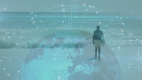Man Walking on Beach Overlaid with Digital Globe and Network