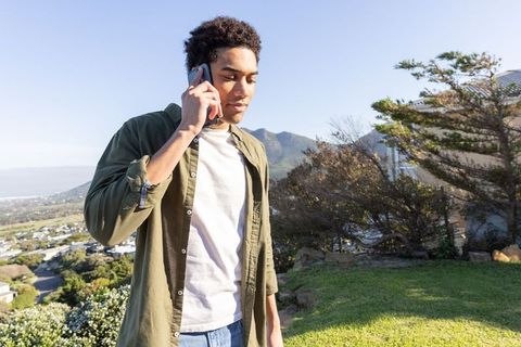 African American Man Talking on Smartphone Outdoors