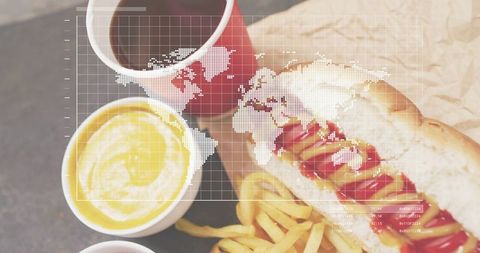 Flatlay showing hot dog, fries and drinks with world map overlay for fast food marketing