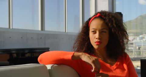 Thoughtful Businesswoman Relaxing in Modern Office