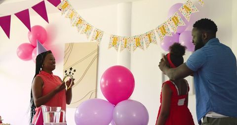 African American Family Celebrating Birthday with Decorations and Joy