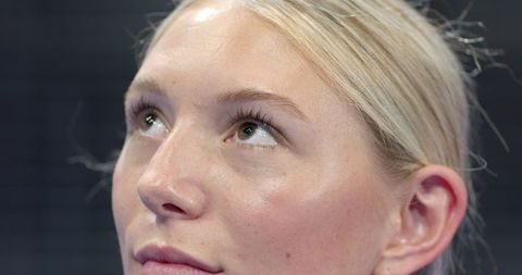 Contemplative Young Woman Gazing Upward with Serenity