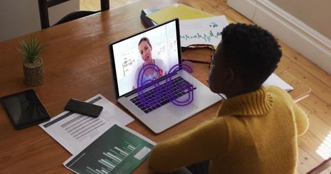 Boy Attending Virtual Class via Video Call with Futuristic Technology Overlay