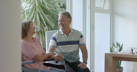 Happy Senior Couple Connecting in Modern Home Interior
