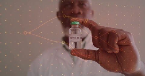 Doctor holding COVID-19 vaccine vial with digital data overlay for clinical trials